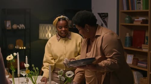 People Preparing Dinner Table for Birthday Celebration