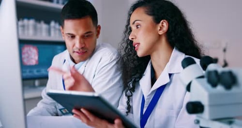 Scientists Collaborate on Research in Modern Laboratory