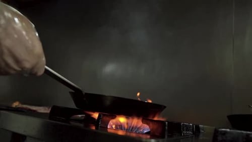 Chef cooking with fire in the kitchen! slow moHD