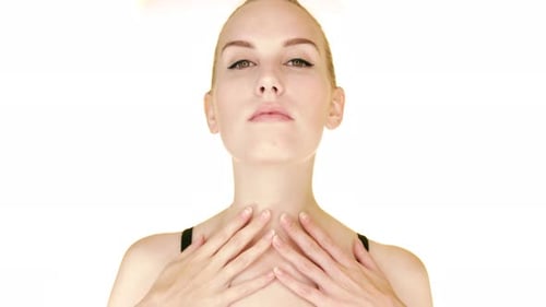 Woman Massaging Neck in Skin Care Routine