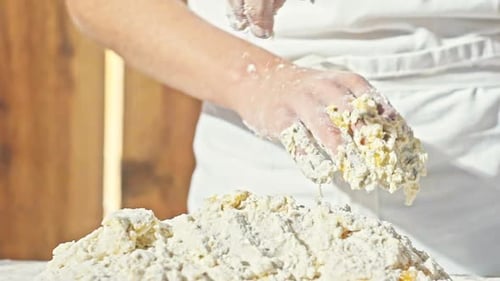 Hands of Little Baker Mixed Eggs with Flour to Make Dough for Bread