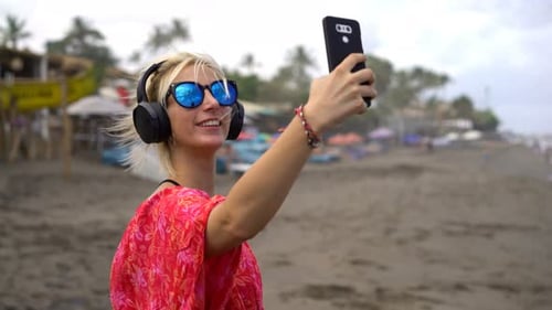 Young Woman Taking Selfie Photo with Cellphone on Beach 20s