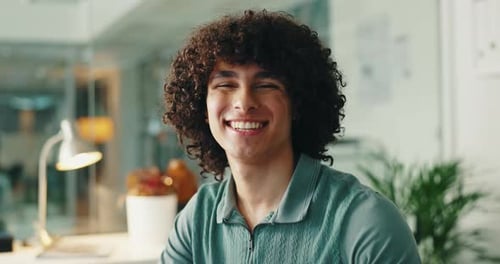 Designer, face and smile of creative man in office for internship or start of development career