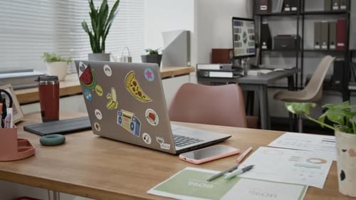 Office Desk with Laptop, Lamp, Travel Mug, Ring Hand Gripper and Business Papers