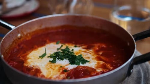 Shakshuka in Iron Frying Pan in Israel Cafe
