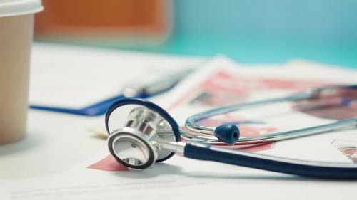 Stethoscope and Paperwork in Doctor's Office