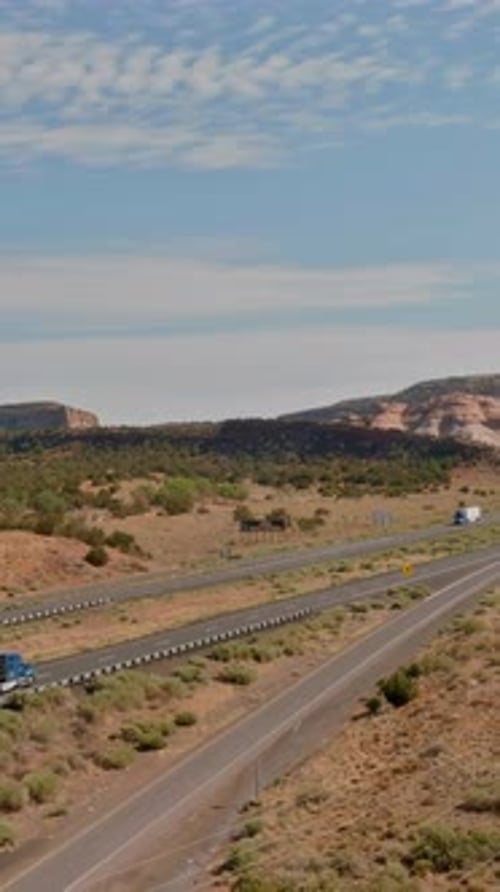 Scenic Highway View Stretches Across Arid Landscape Under Clear Blue Sky