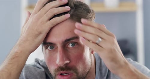 Man Running Fingers Through Hair Close Up