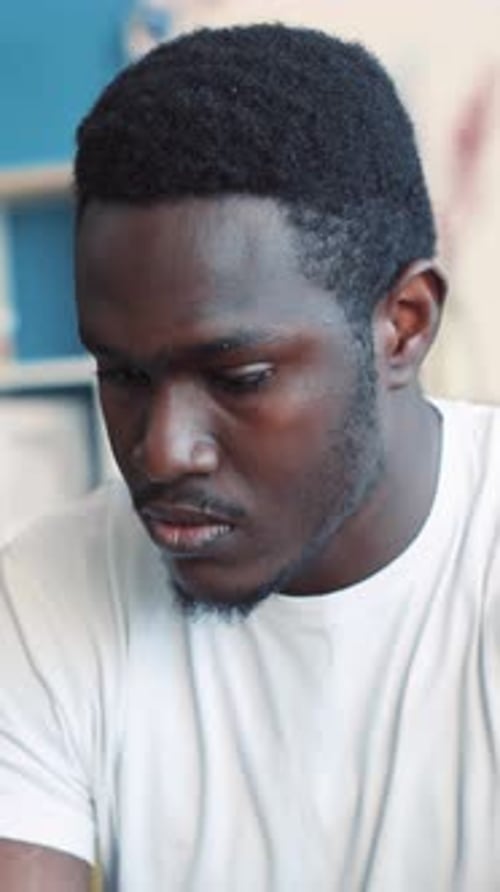 Close Up of Adult Man Looking Down and Away