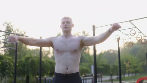 Young Male Athlete with Naked Torso in an Intense Outdoor Workout