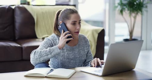 Woman Works from Home Talking on Cellphone