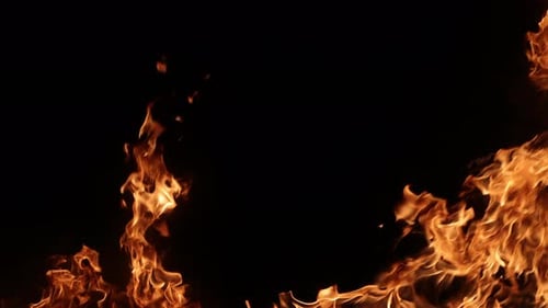 Burning Flames Flickering on Dark Background