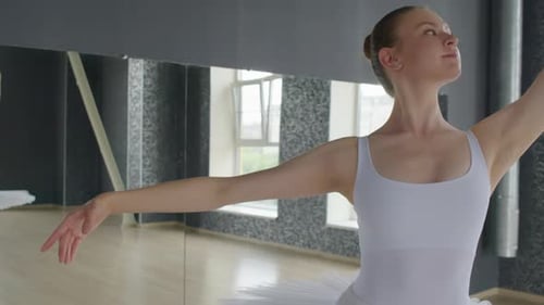 Ballerina Doing Circular Arms Movements when Training in Studio