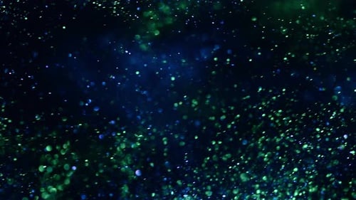 Grüne und blaue Partikel, beweglicher schwarzer Hintergrund, abstrakter Filmhintergrund