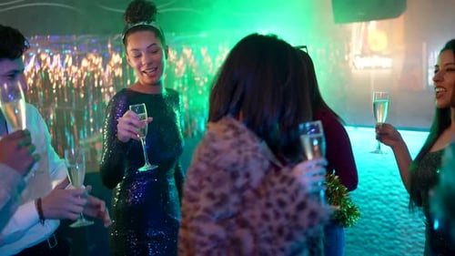 Friends Celebrating at Nightclub with Champagne and Glitter