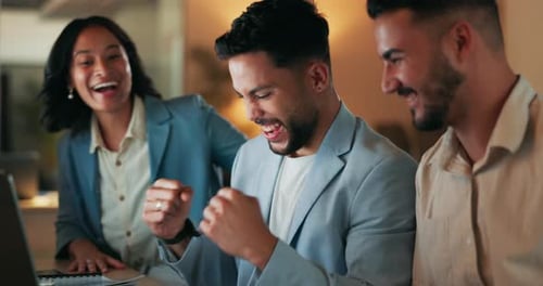 Colleagues Celebrating Success in Modern Office