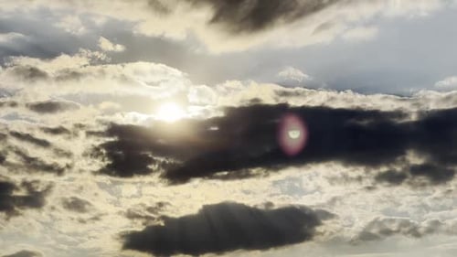 Sun Shines Through Fluffy Clouds Timelapse