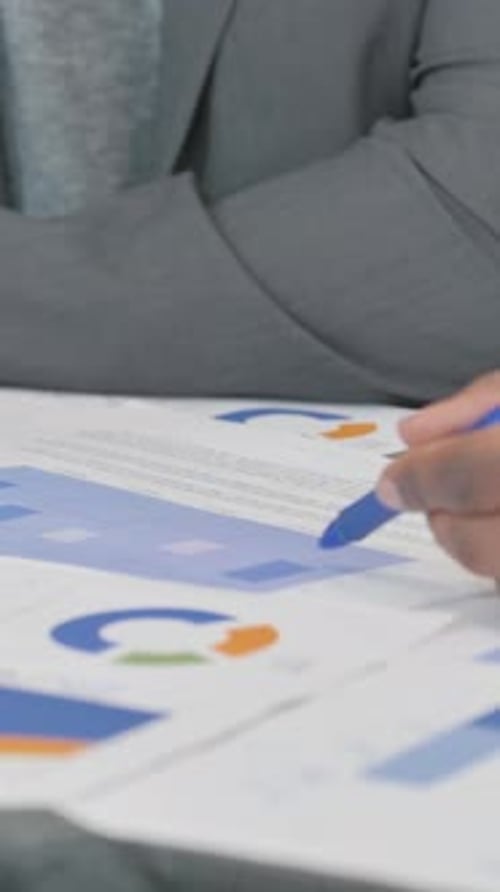 Close up of Hands Discussing Business Report at Work, vertical video