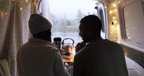 People Enjoying Nature Views From Camper Van