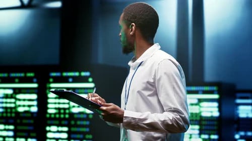 Man Reads Report in Futuristic Tech Environment