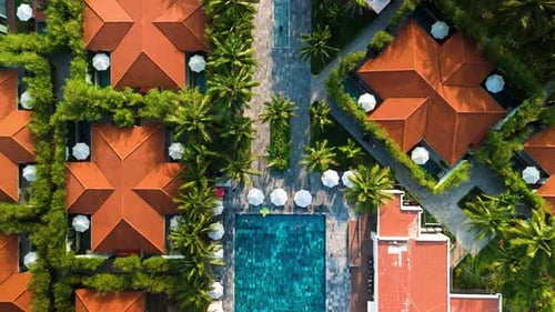 Aerial View Revealing Luxurious Tropical Resort Sparkling Swimming Pool Nestled Among Verdant Palm
