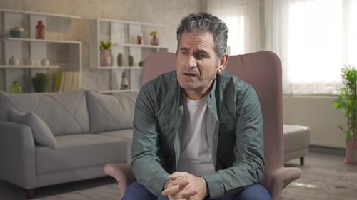Worried mature man suffering from depression and loneliness not feeling well at home.