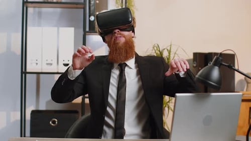 Young Business Man in VR Goggles Watch Virtual Reality Video Working on Simulation Game at Office