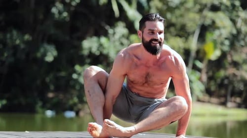 Athletic Man Doing Yoga on Dock Outdoors