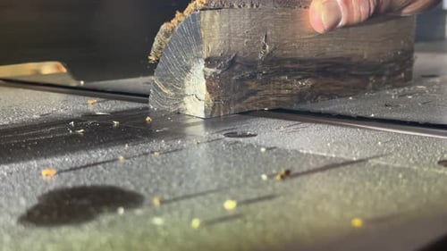 Close Up of a Dark Wood Block Being Cut