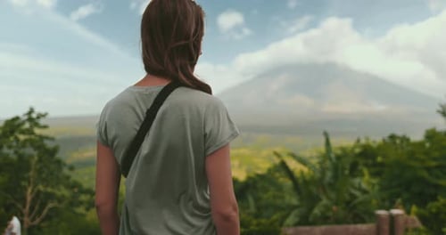 Young Woman Enjoying Tropical View with Mayon Volcano in the Philippines