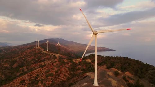 Wind Turbines at Sunrise Aerial Shot