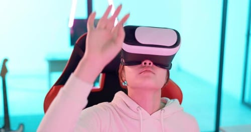 Young Woman Immersed in Virtual Reality Gaming