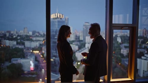 Late Workers Meeting Office Panoramic Window Smiling Coworkers Shaking Hands