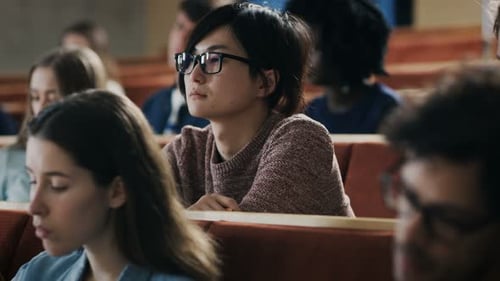 College Students Listening to Lecture in Auditorium