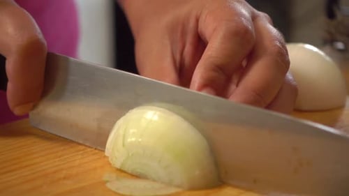 Onion Slicing on Cutting Board Close Up