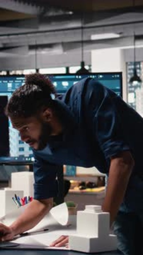 Vertical Video Middle Eastern Engineer Reviewing Construction Site Measurements