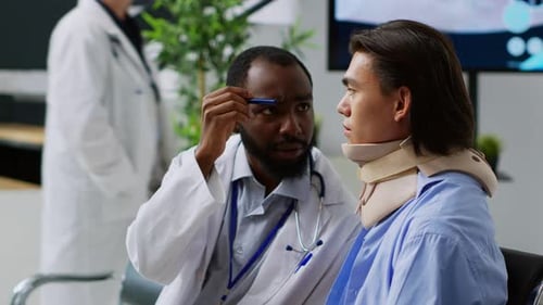 Doctor Explains Diagnosis to Patient Wearing Neck Brace