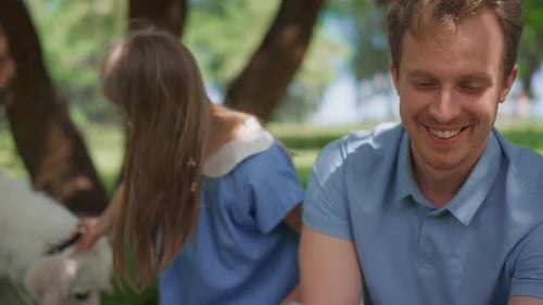 Happy family in a park with their dog