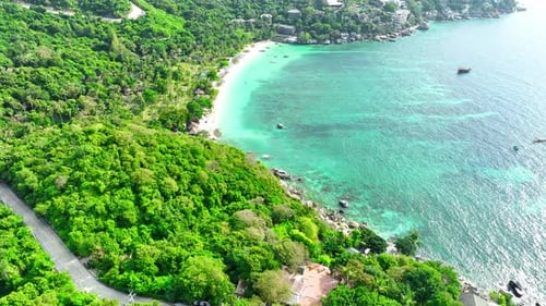 Sandy beach coastline in a tropical island in Thailand from aerial view.