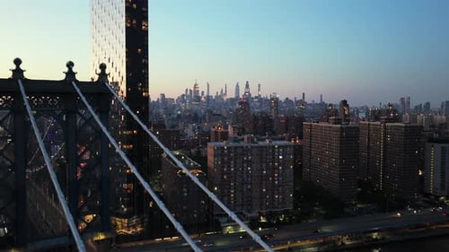 Close Up Aerial View of New York City's Brooklyn Bridge at Sunset Capturing the Iconic Skyscrapers