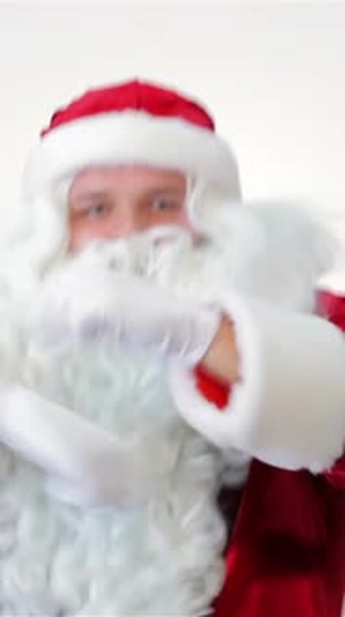 Santa Claus in Costume Gesturing to Camera