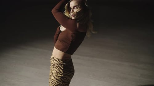 Woman Dances in Studio with Dynamic Poses