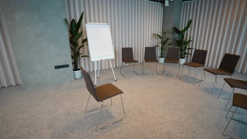 Empty Chairs Arranged in Circle for Therapy Session in Modern Office
