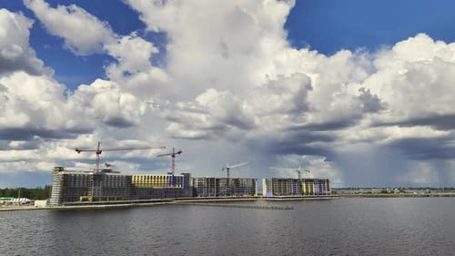 Tower Cranes and Frame Structure of High Residential Apartment Buildings at Construction Site