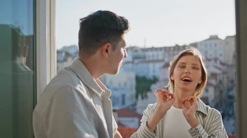 Young Couple Embracing in Bright Urban Apartment