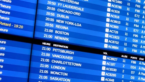 Flight information status display close up, airport departures and destinations