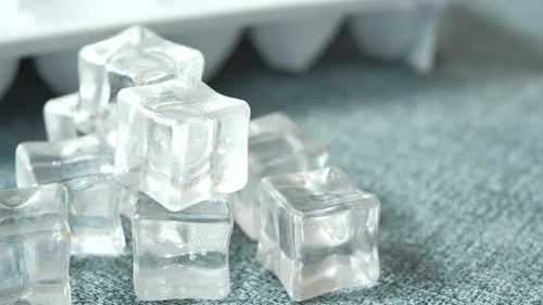 Close Up of Many Ice Cubes on White Background
