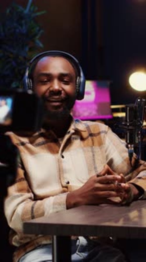 Man Recording Podcast Episode With Phone