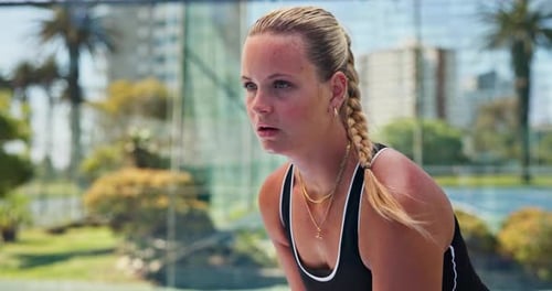 Woman, playing and sport with padel tennis for ball, smash or training on outdoor court