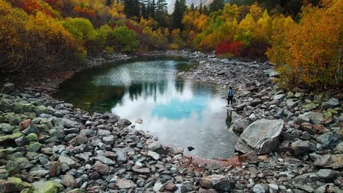 Aerial View Of Landscape With Small Lake In Forest In Autumn Day Person Throwing Stones In Water